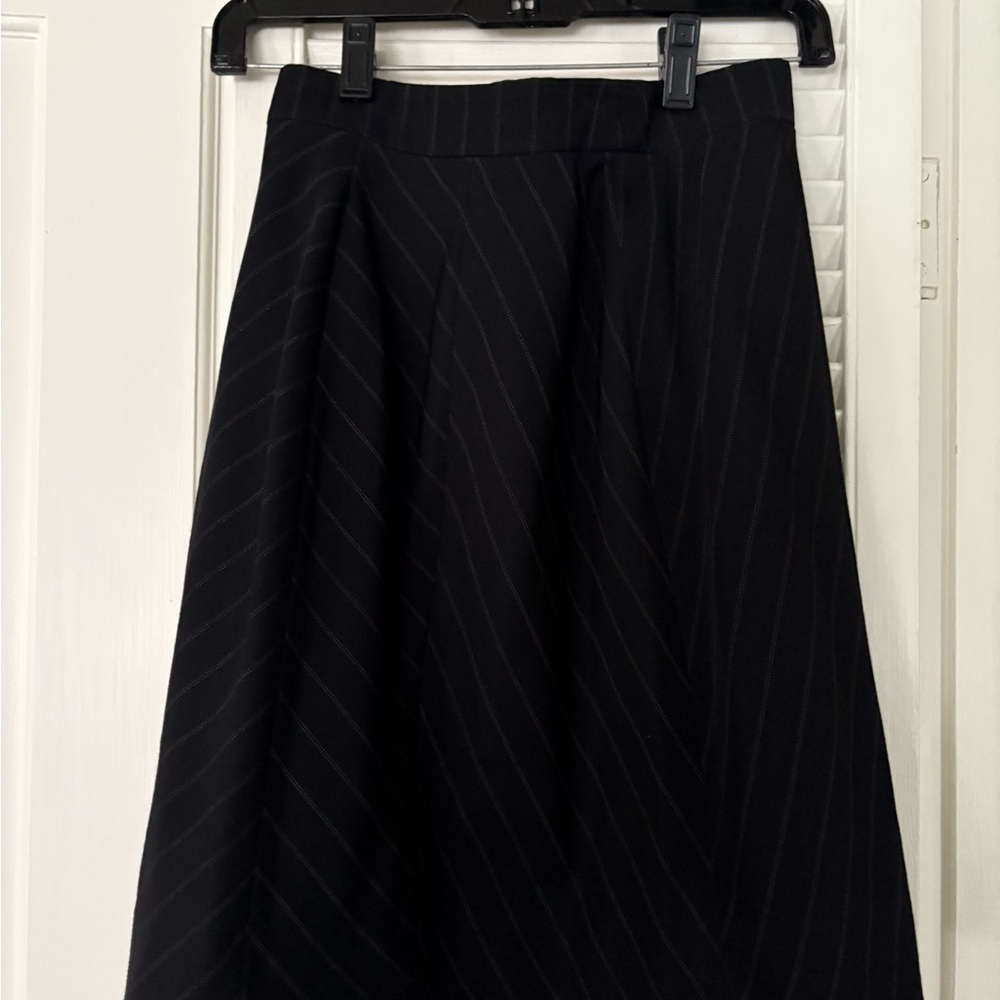 Richard Tyler pinstripe skirt and blazer.